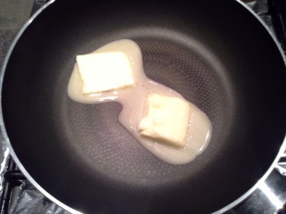 Melted butter in pan