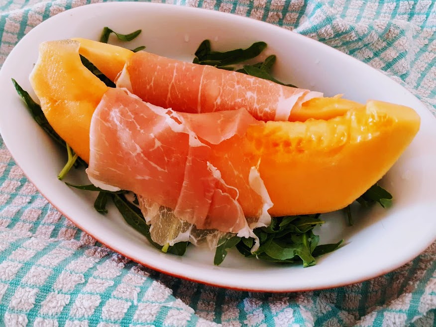 ORANGE MELON AND PROSCIUTTO WITH ARUGULA APPETIZER