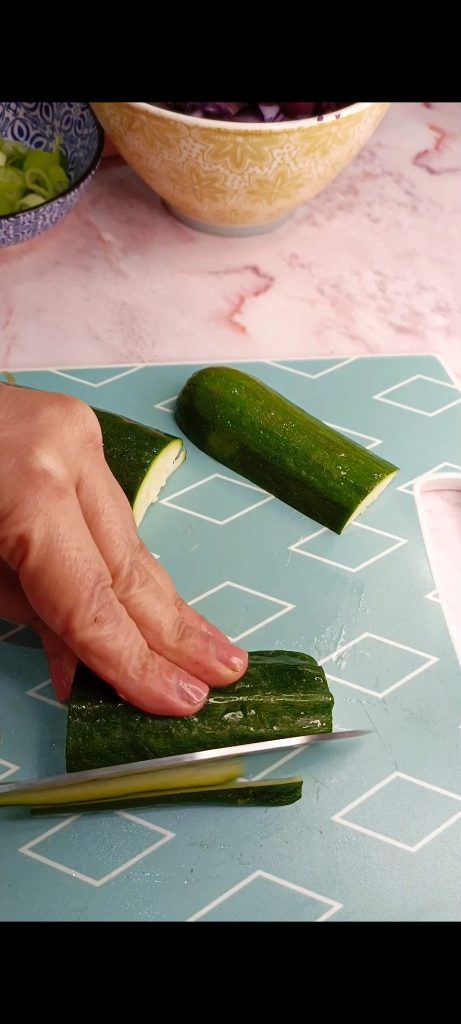 Cut zucchini and carrots into strips