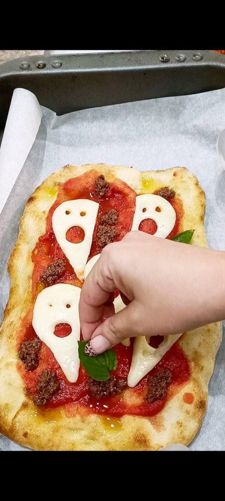 Adding the black olive pâté