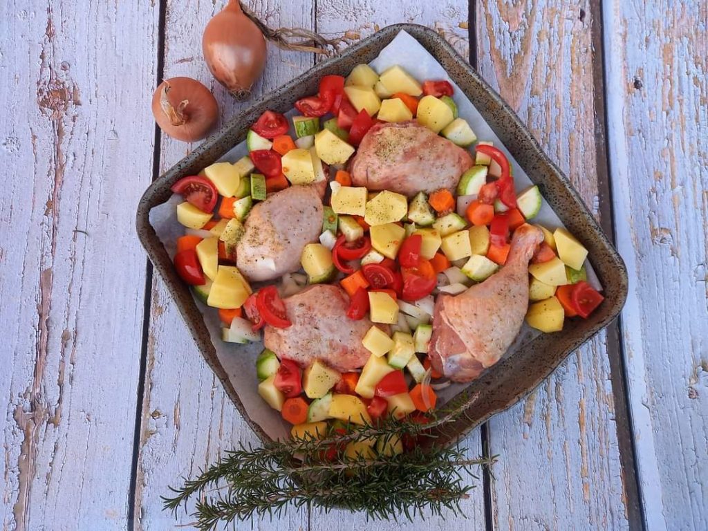 Baked chicken with potatoes and vegetables