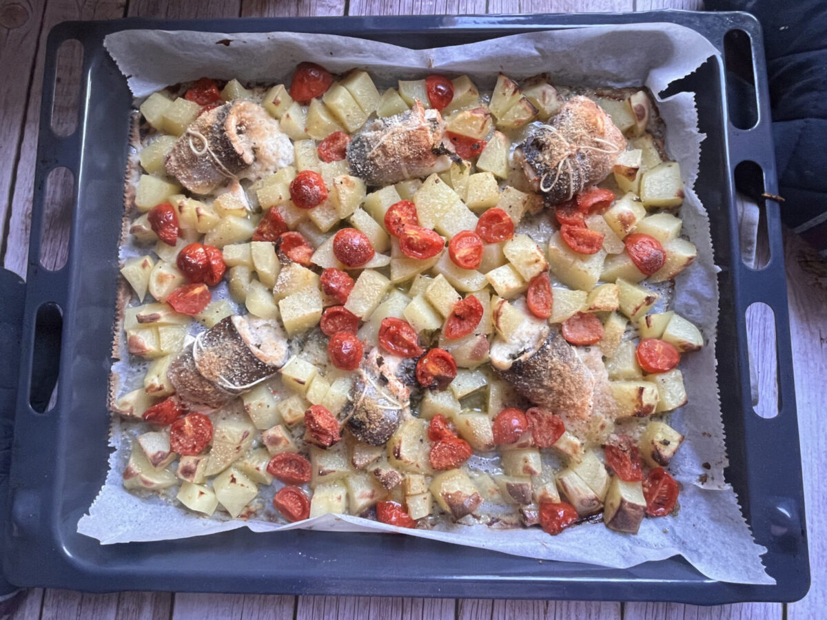 Baked Sea Bass Spirals with Potatoes and Cherry Tomatoes.
