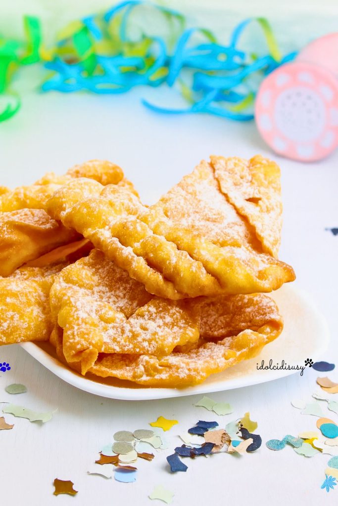 crispy carnival fritters dusted with powdered sugar