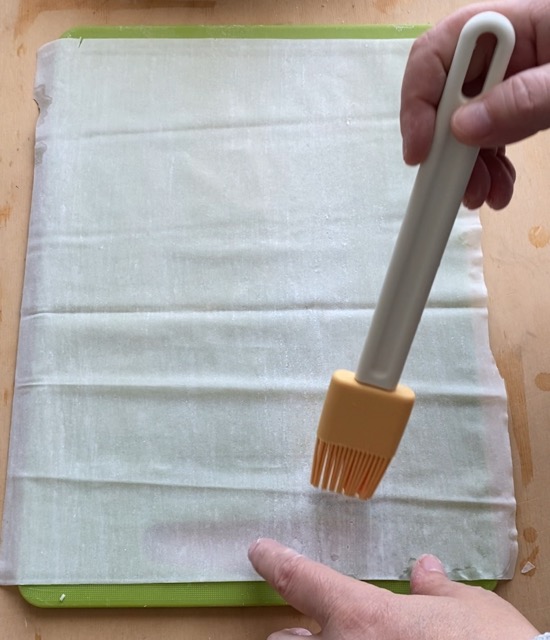Grease a phyllo sheet