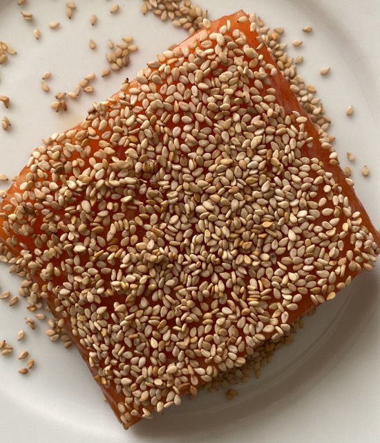 Coat with sesame seeds