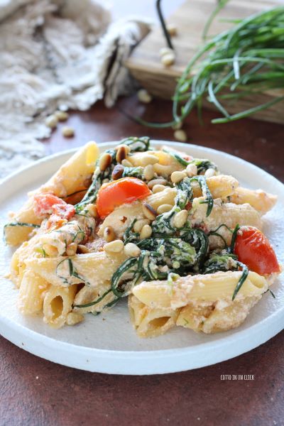 add the toasted pine nuts, mix and serve