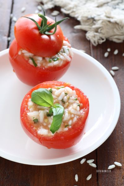 arrange the tomatoes on a plate, decorate with a basil leaf and serve