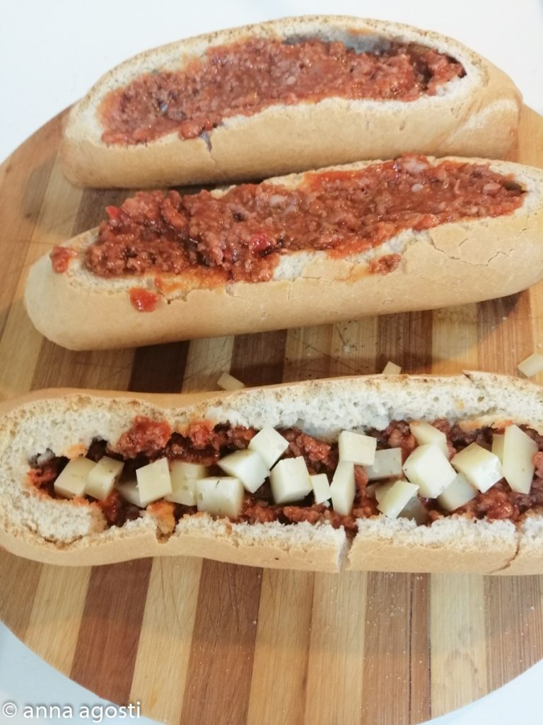 Baguette stuffed with meat and mozzarella