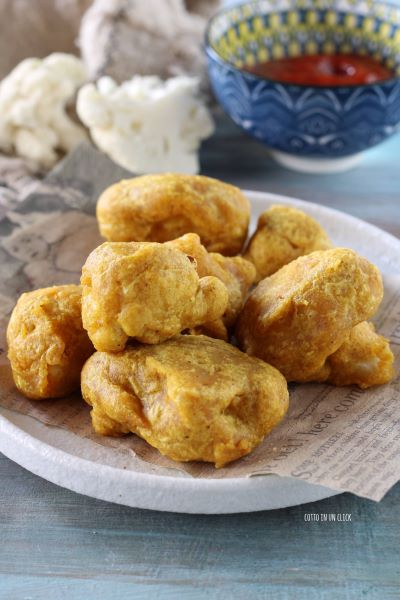 drain the cauliflower fritters on absorbent paper and serve