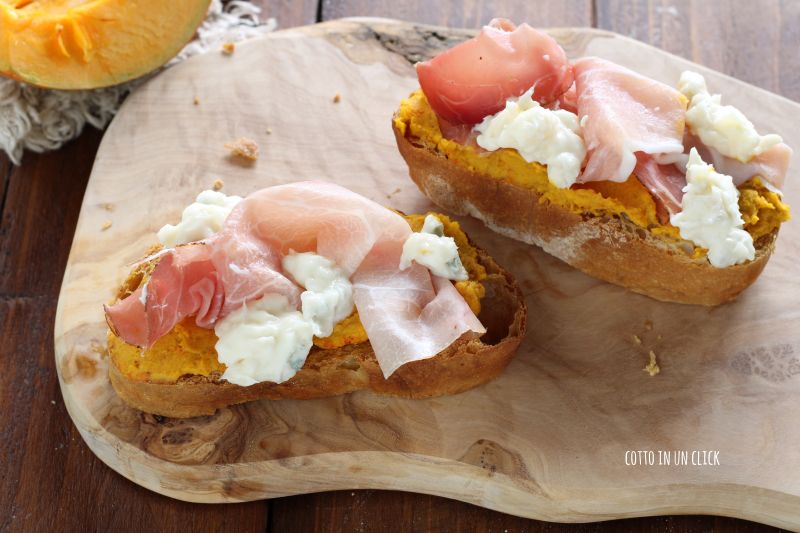 Crostini with pumpkin, speck, and gorgonzola