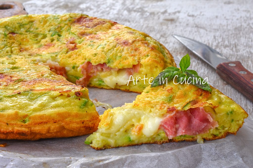 Quick pancake pie with zucchini and ham in a pan