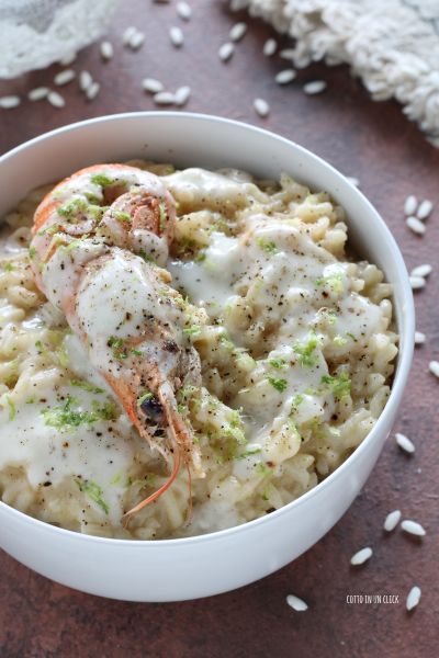 serve the risotto with a scampi for each diner, pepper and lime zest