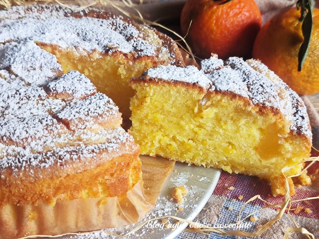 Slice of creamy orange cake with mascarpone, a soft and aromatic homemade dessert