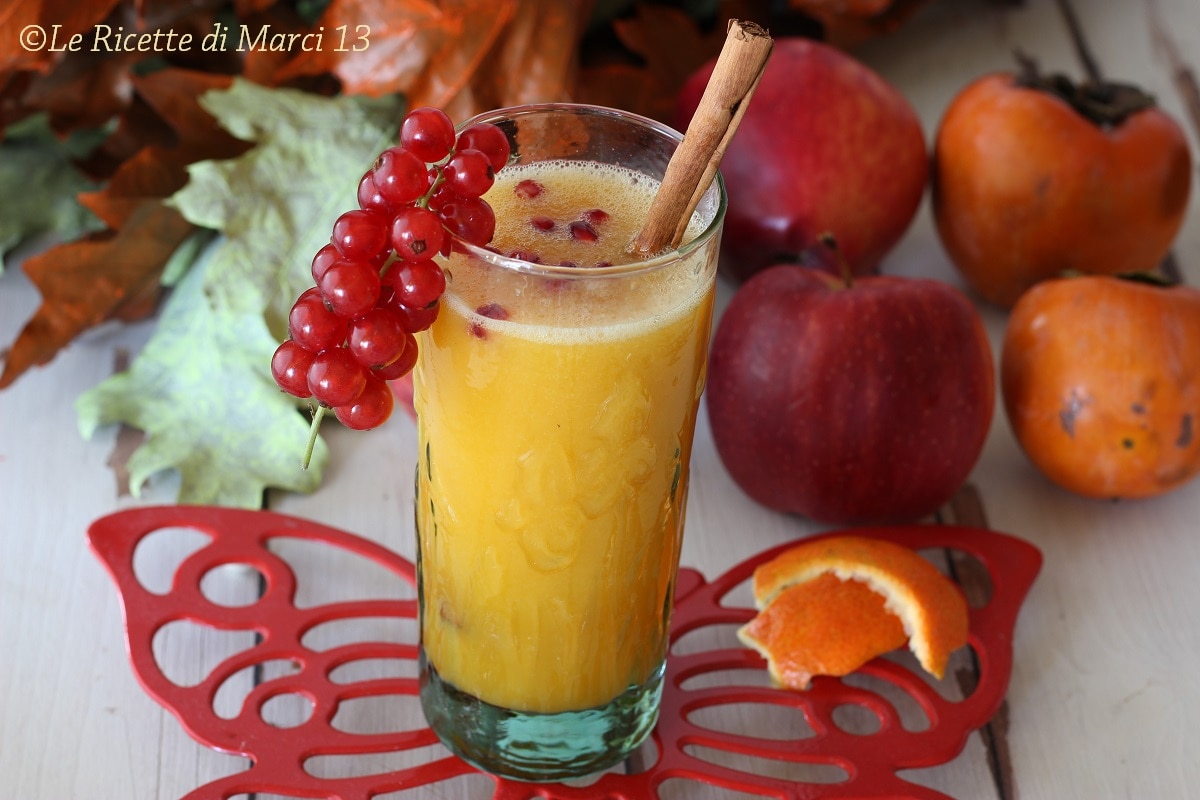 Spiced Christmas smoothie with apples, clementines, and persimmons.