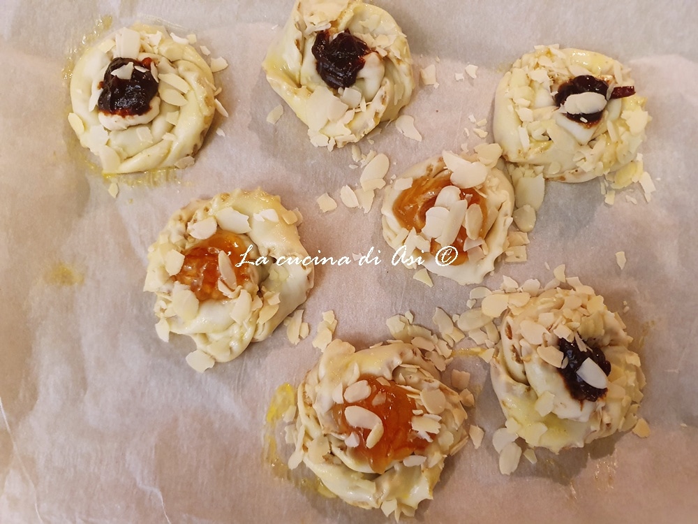 swirls with jam, almonds, and walnuts