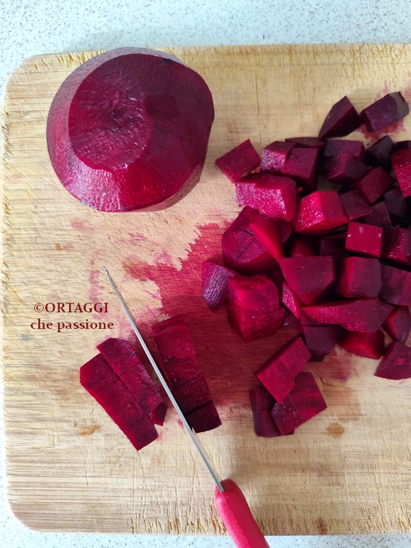 cutting red beets into regular pieces