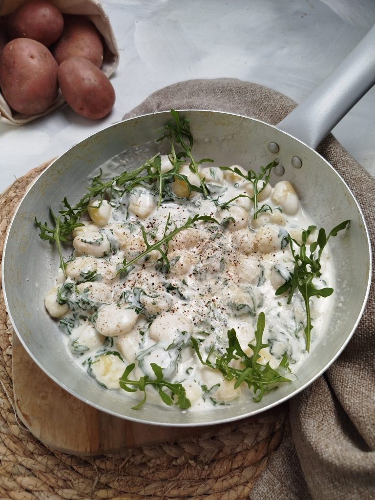 Gnocchi with stracchino and arugula