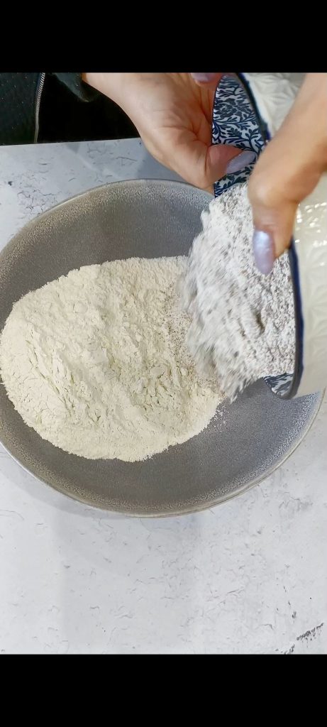 Whole wheat flour and all-purpose flour in blue bowl