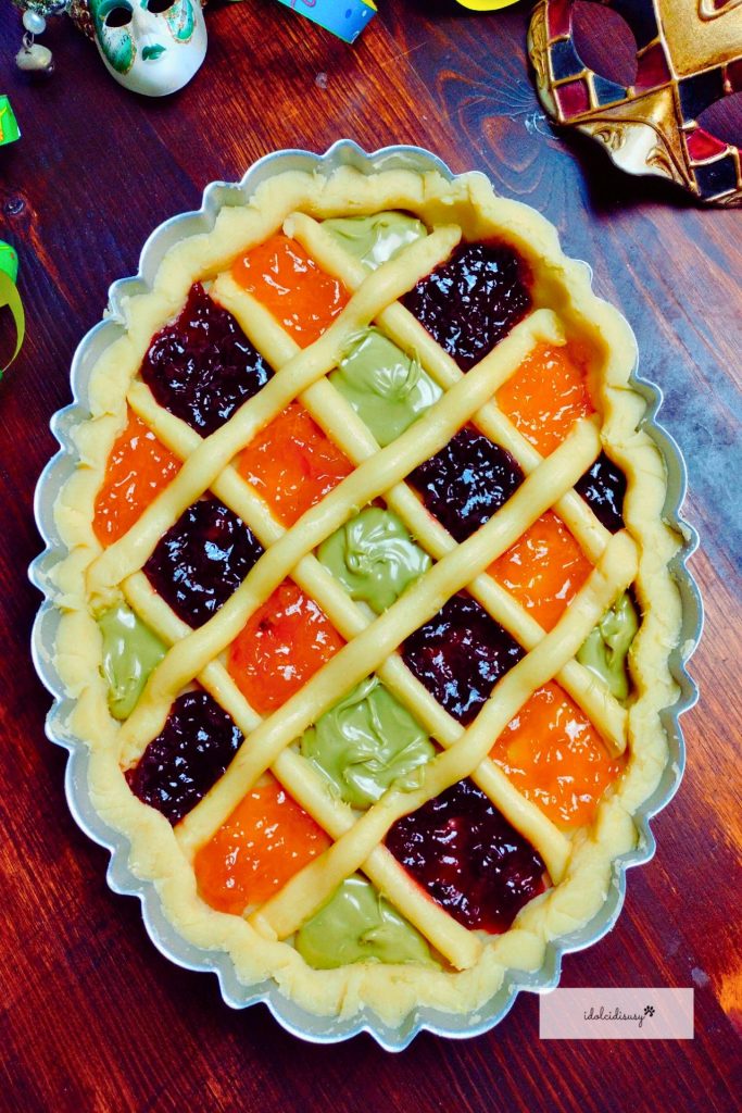 Arlecchino Carnival Tart with shortcrust pastry and colorful filling, ready to bake