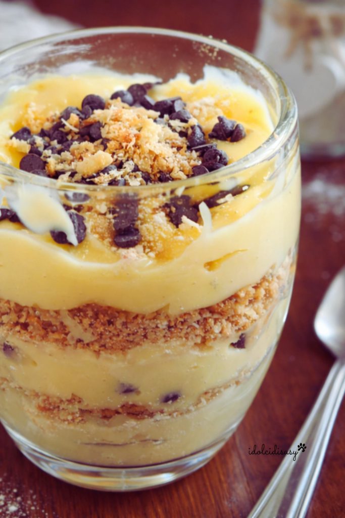 Napoleon in a glass with custard and chocolate chips, dessert in a glass with layers of crumbled pastry and cream