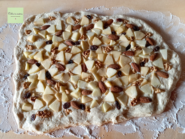 distribute the filling of apples, walnuts, and almonds