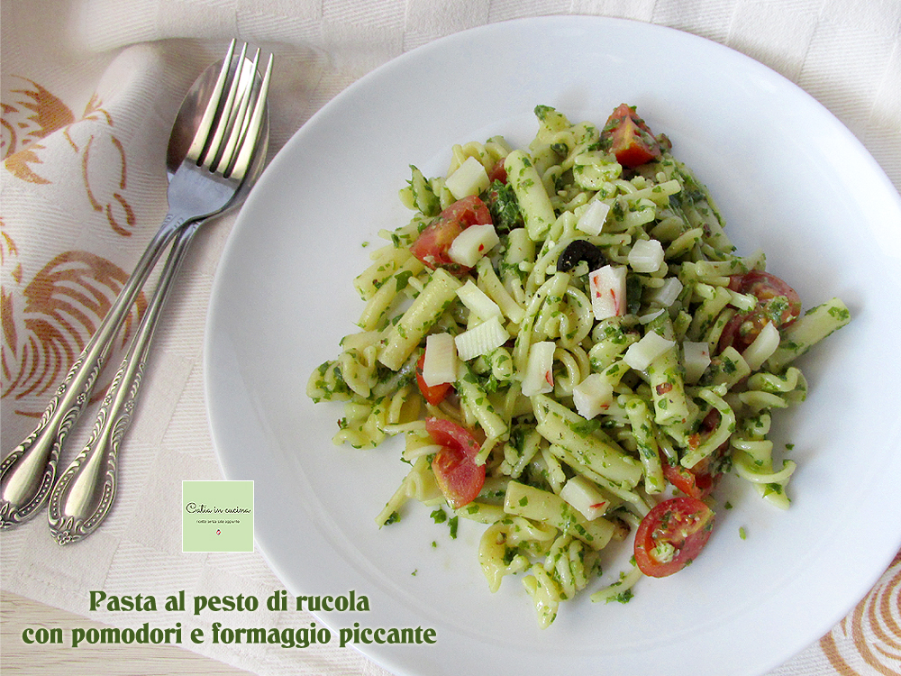 Light arugula pesto pasta with tomatoes, olives and…