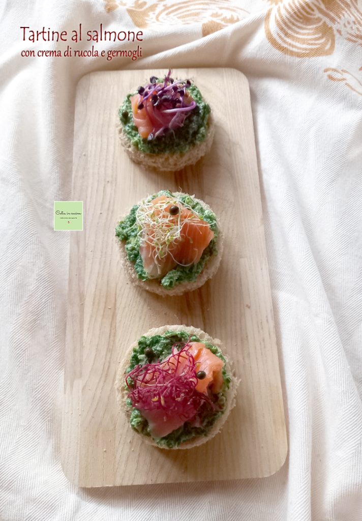 salmon canapés with arugula cream and sprouts