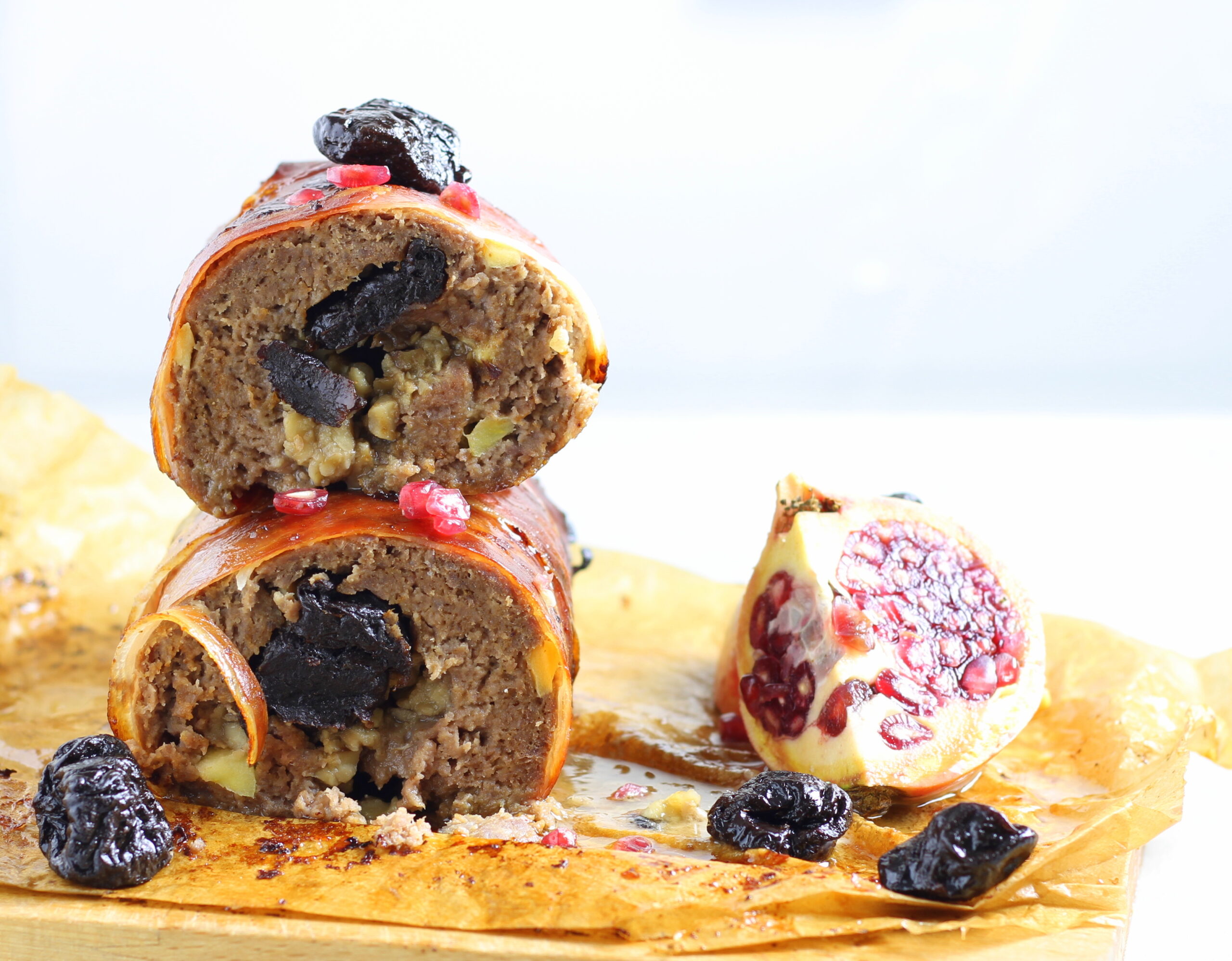 Stuffed Meatloaf with Apple, Chestnuts, and Prunes Wrapped in Speck
