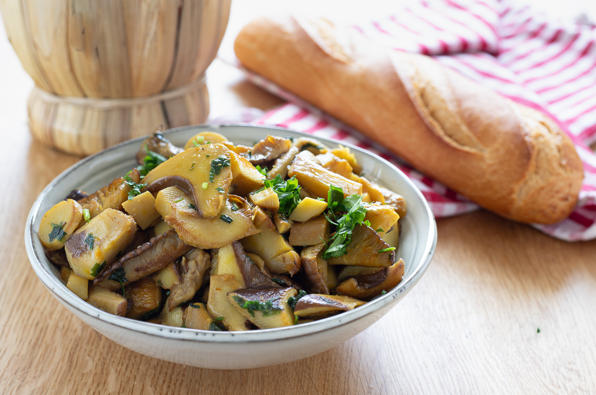 Sautéed king oyster mushrooms in a skillet