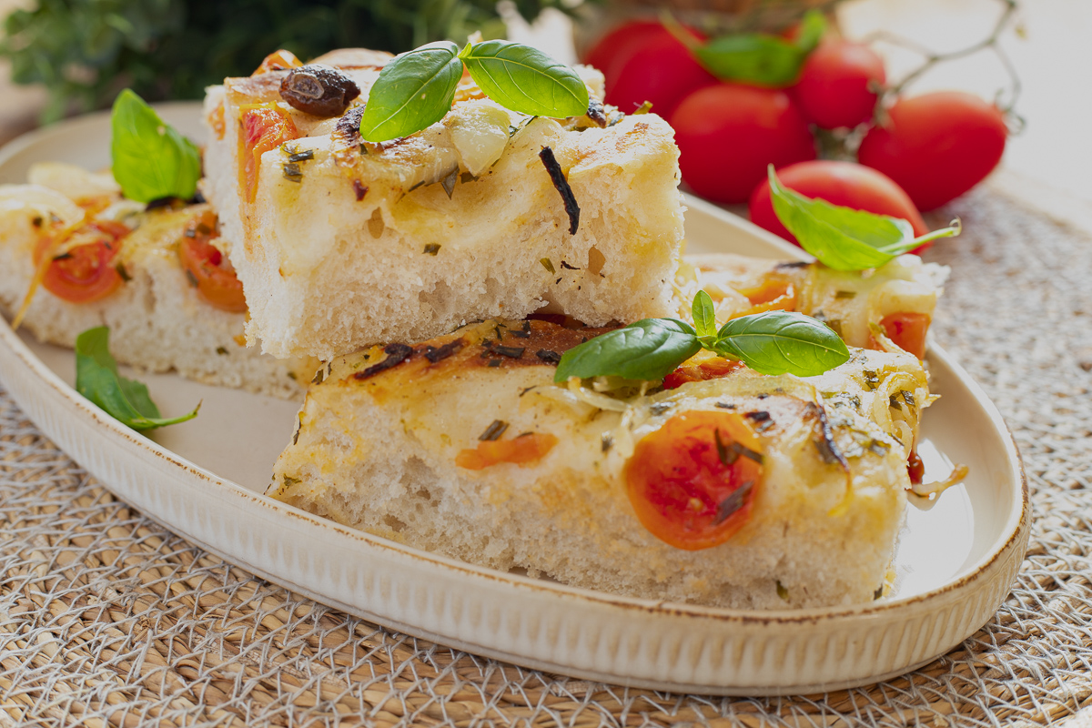 Focaccia with onions, cherry tomatoes and olives