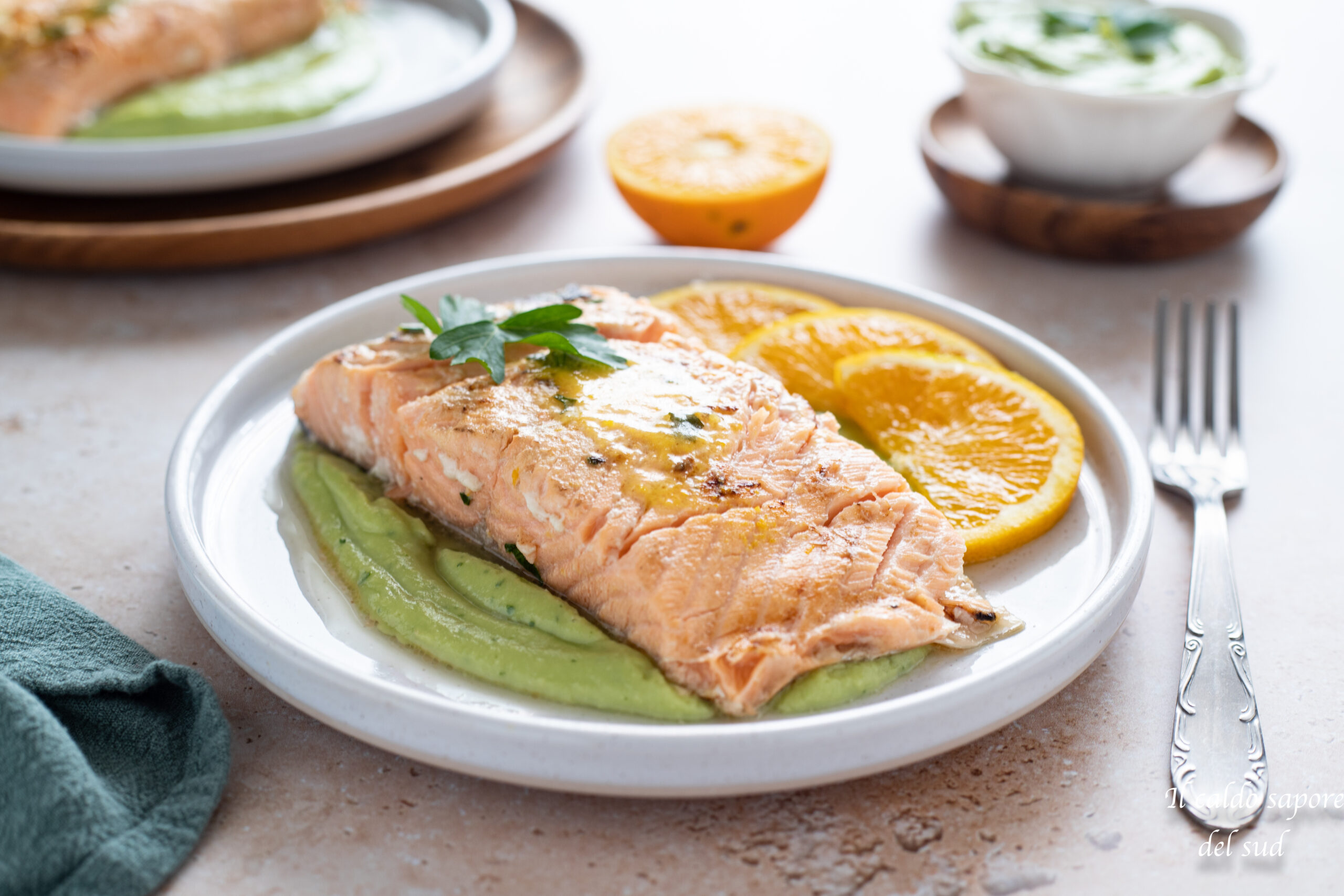 Orange vacuum-cooked salmon with avocado cream