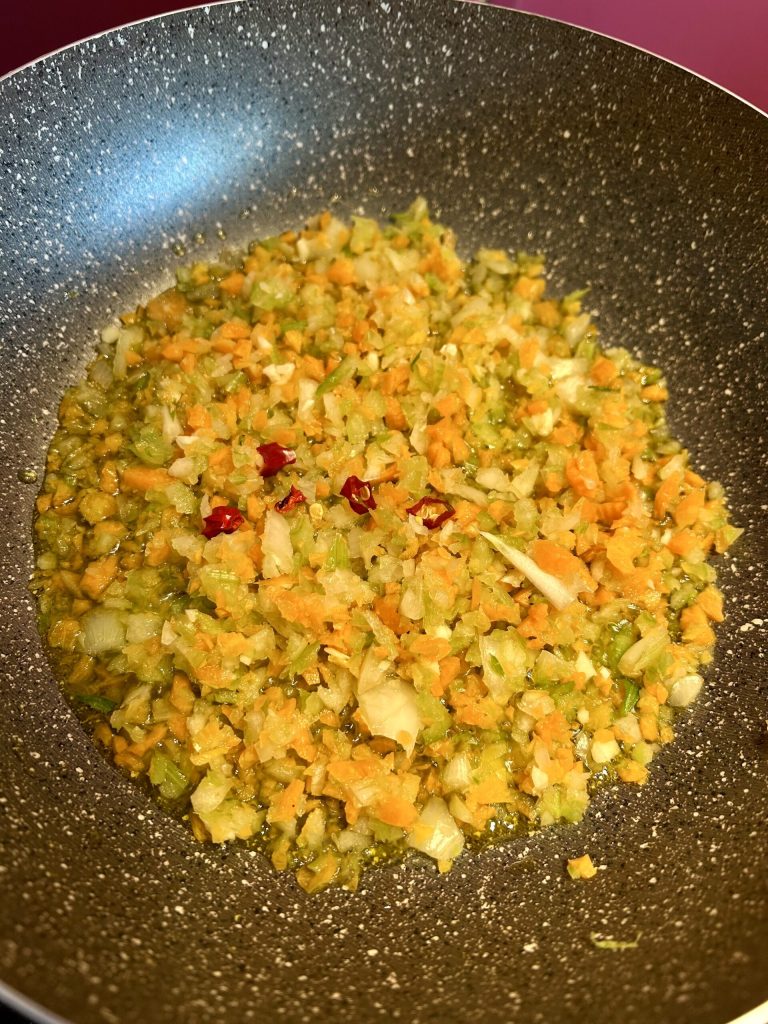 Sauté of celery, carrot, onion, and chili pepper for quick Roman-style tripe with pecorino
