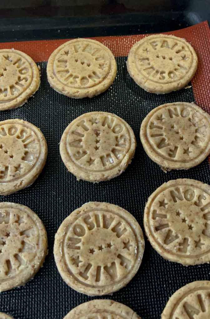 Sugar-free cookies with raisins and almonds on the baking tray before baking