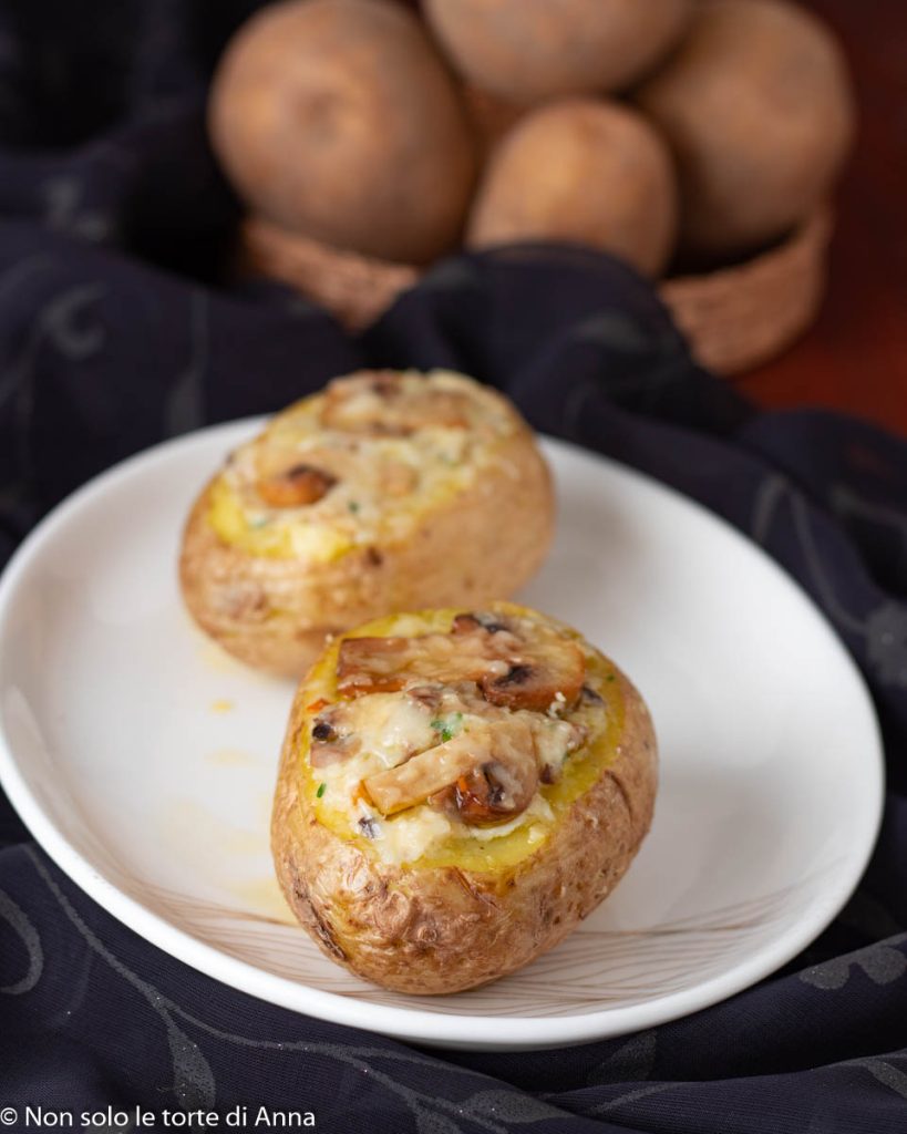 Microwave cooked stuffed potatoes with mushrooms and ricotta
