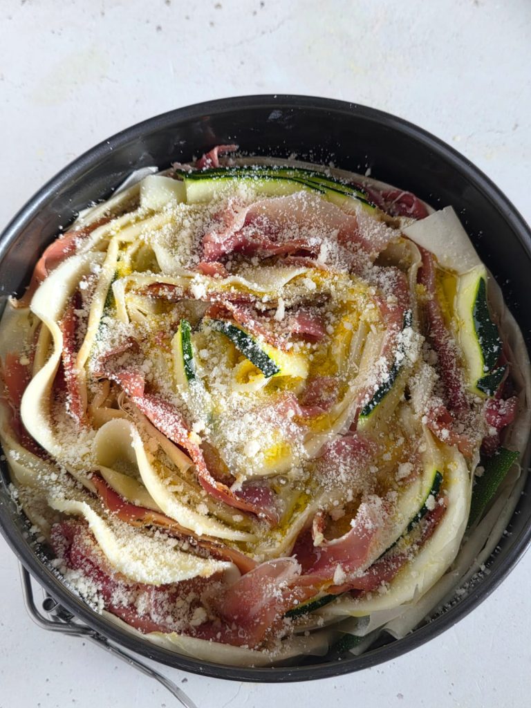 Savory filo pastry tart with zucchini, speck, and cheese