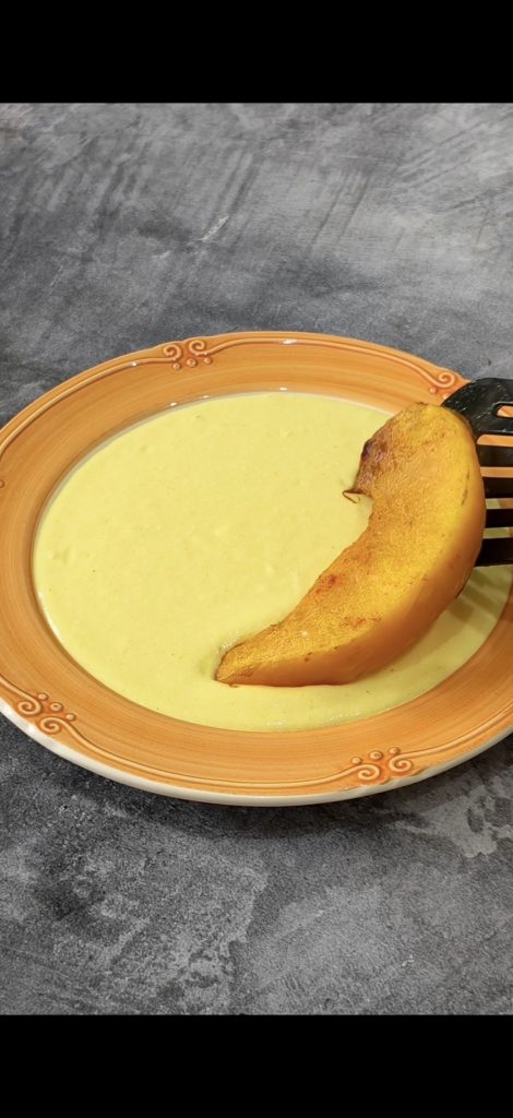 Plate the dish with egg sauce and pumpkin