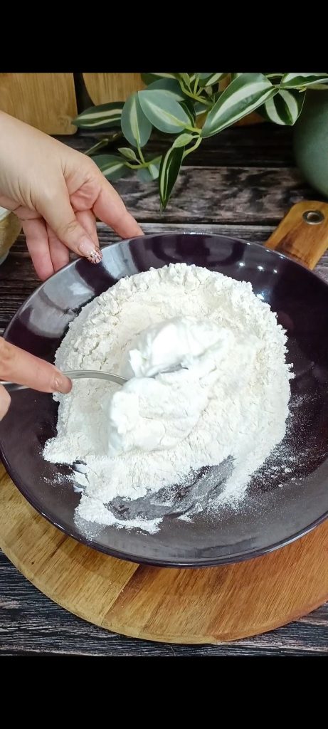 Mix flour, yeast, and yogurt