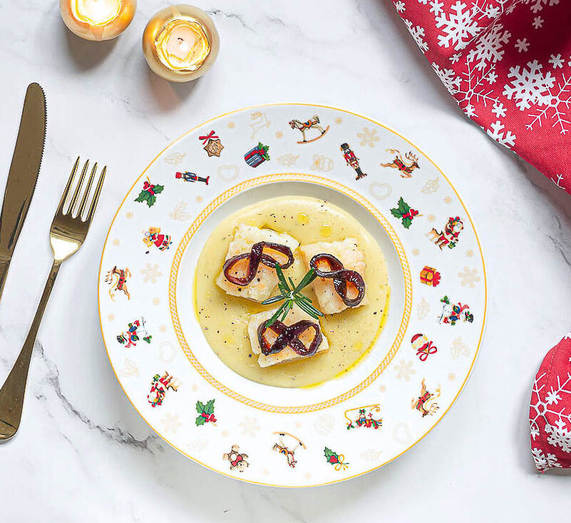 Salt cod on potato cream with caramelized onions