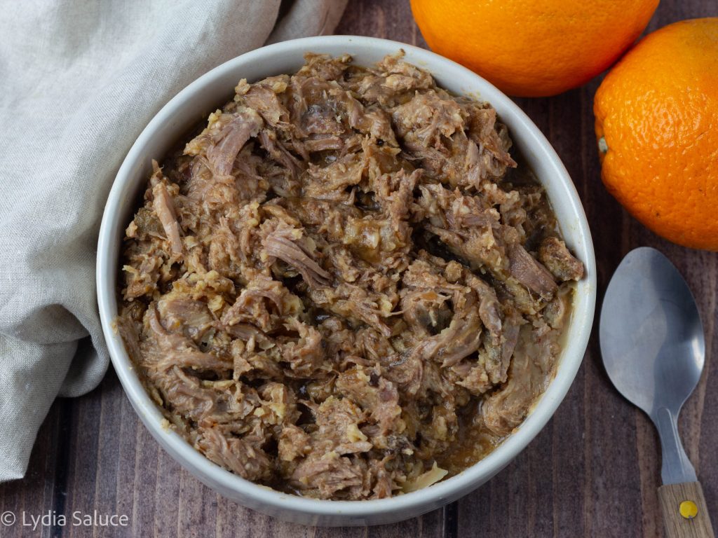Shredded orange pork in slow cooker