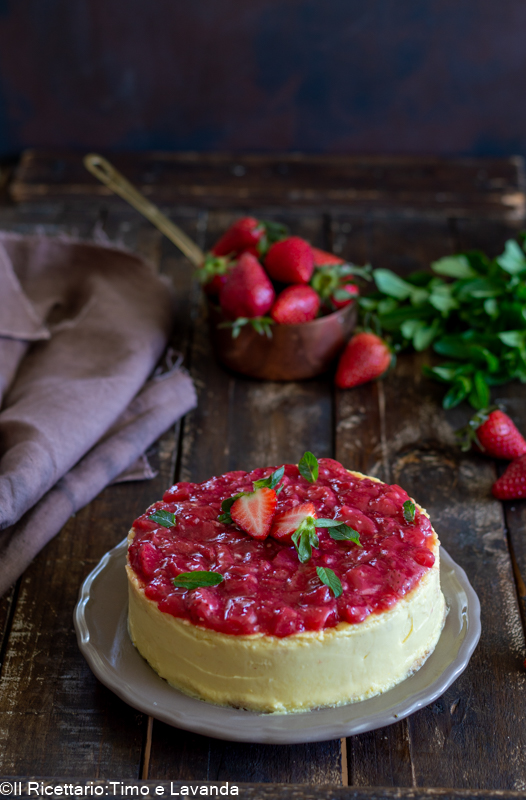 vegan no-bake cheesecake with strawberry gel on a white plate