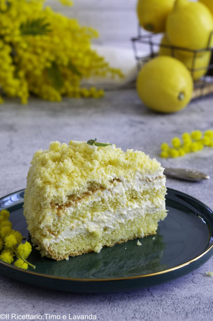 Slice of lemon mimosa cake, gluten-free, with velvety lemon cream and soft lactose-free sponge cake.