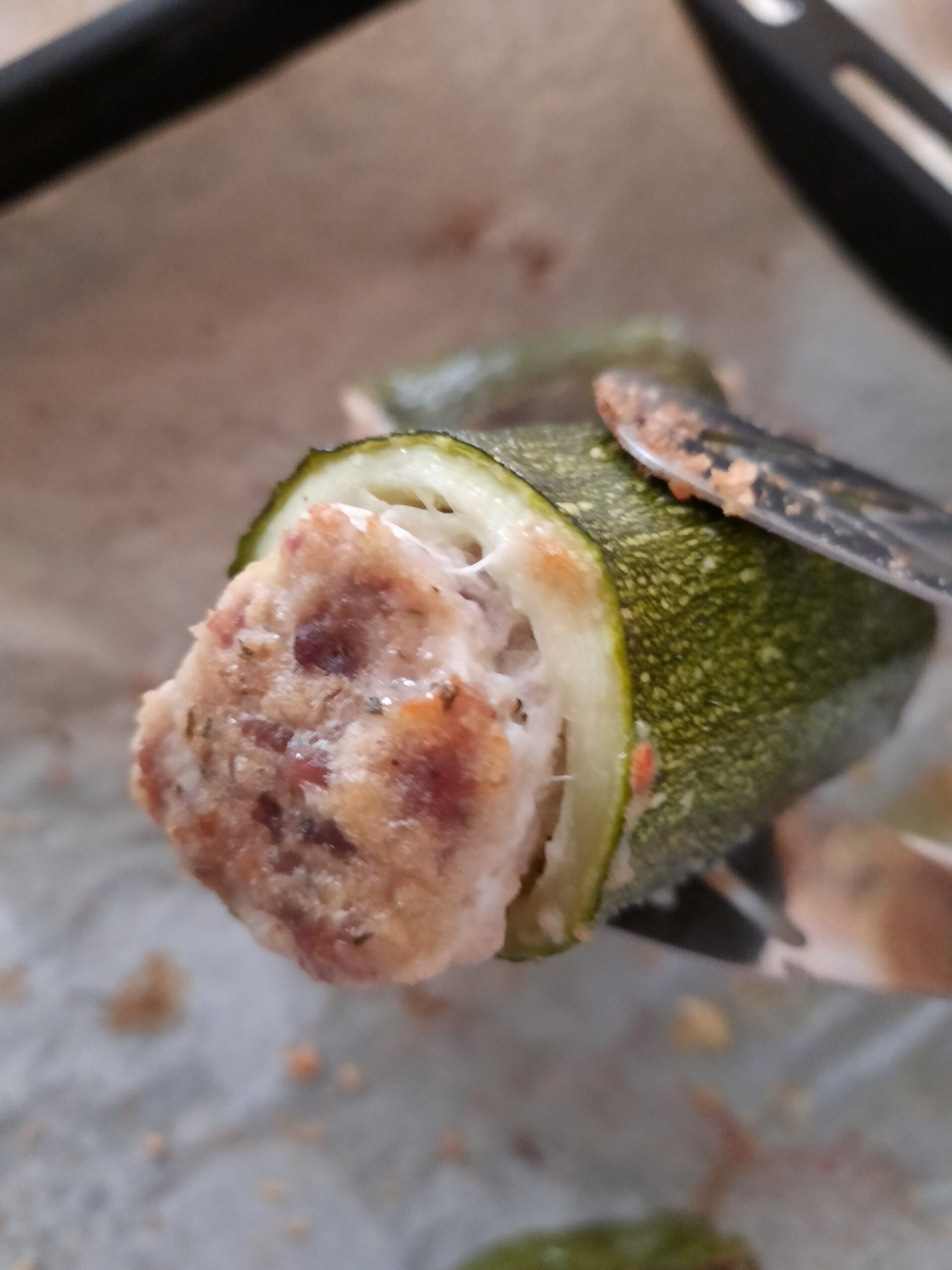 Baked stuffed zucchini with sausage and provola