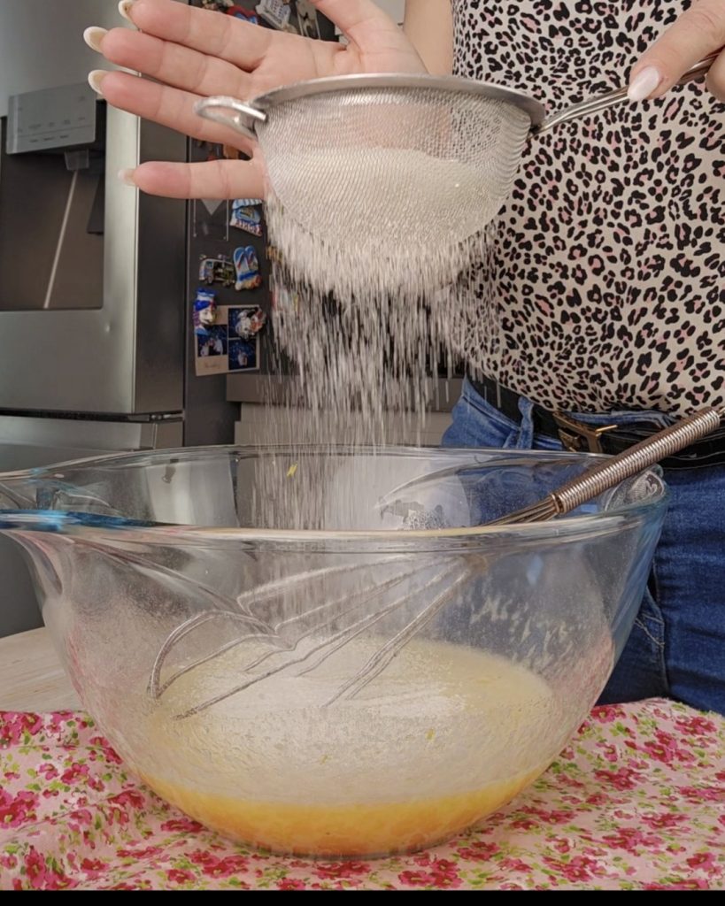 fold in the sifted flour and baking powder