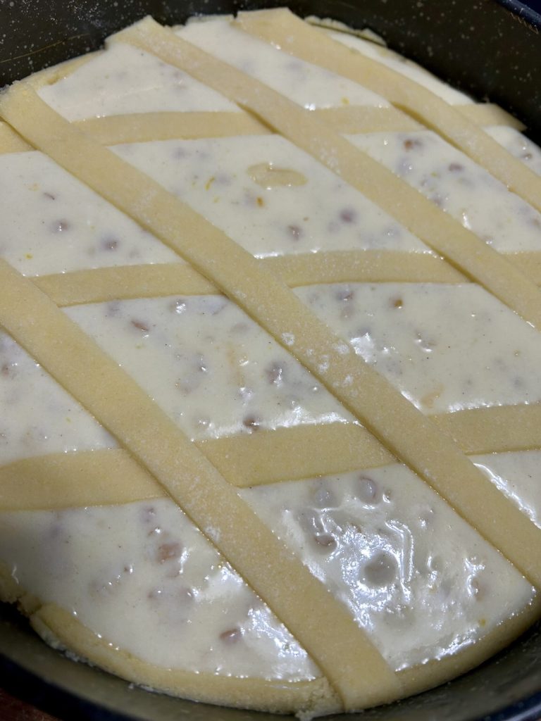 uncooked pastiera with shortcrust strips before baking