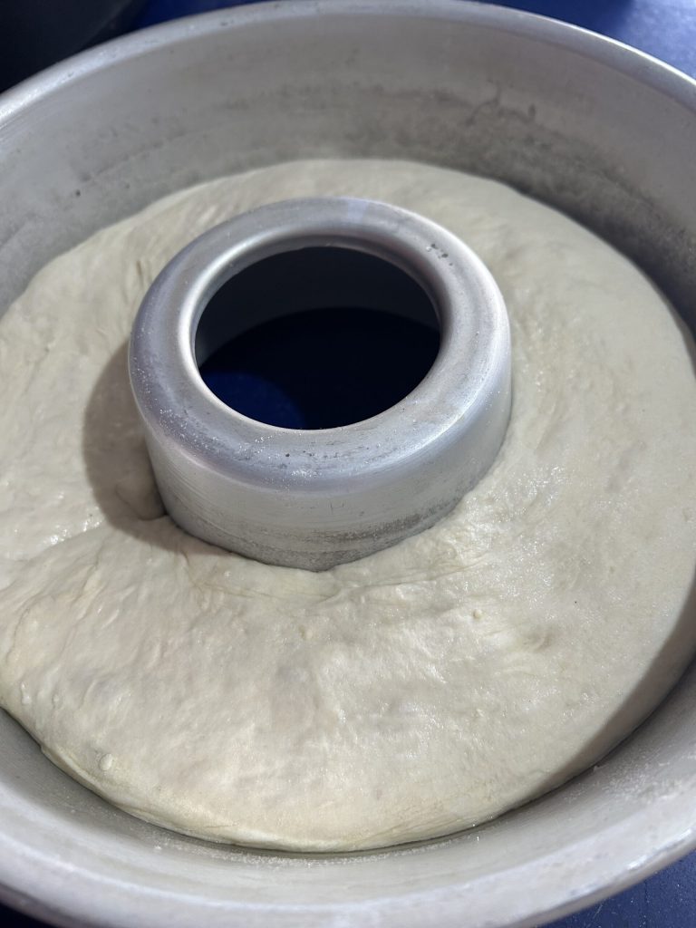 sourdough bread in the bundt pan before proofing