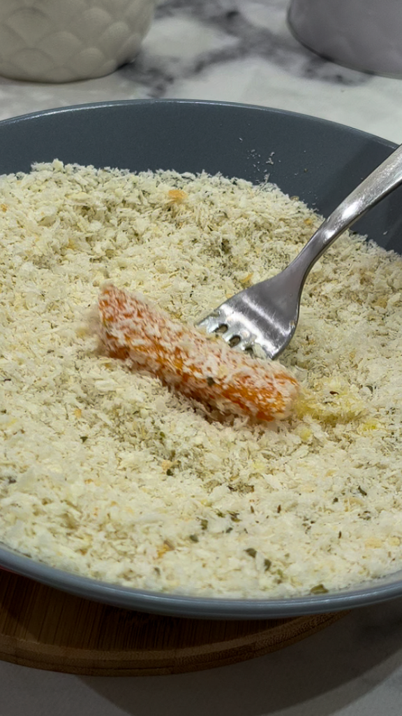 We pass the sweet potato sticks first in the eggs and then in the panko