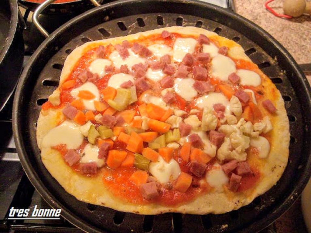 Pizza on a plate half giardiniera and half margherita