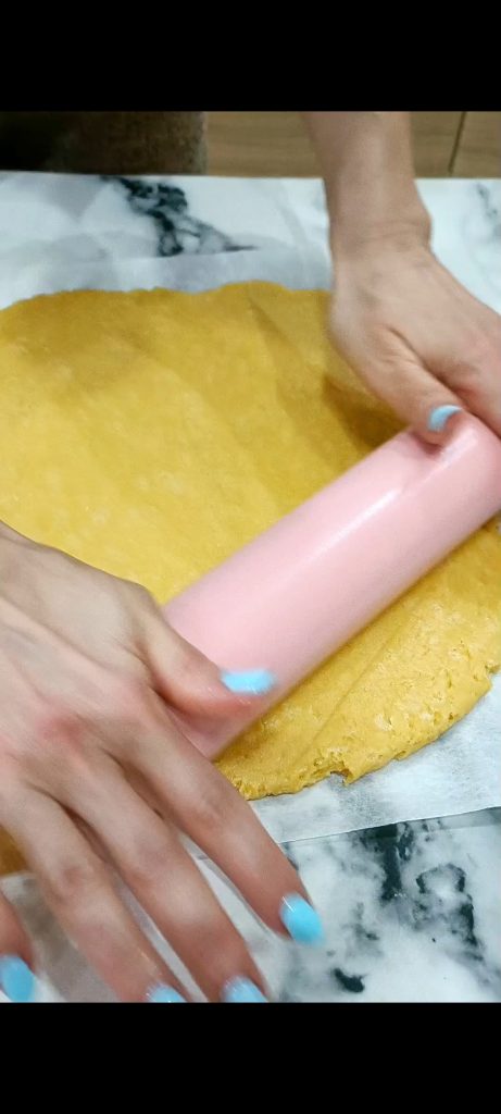 Rolling out the dough with the rolling pin