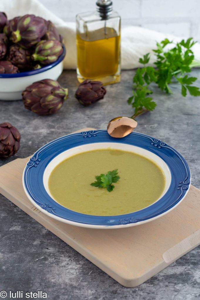 Creamy artichoke velouté served in a white bowl