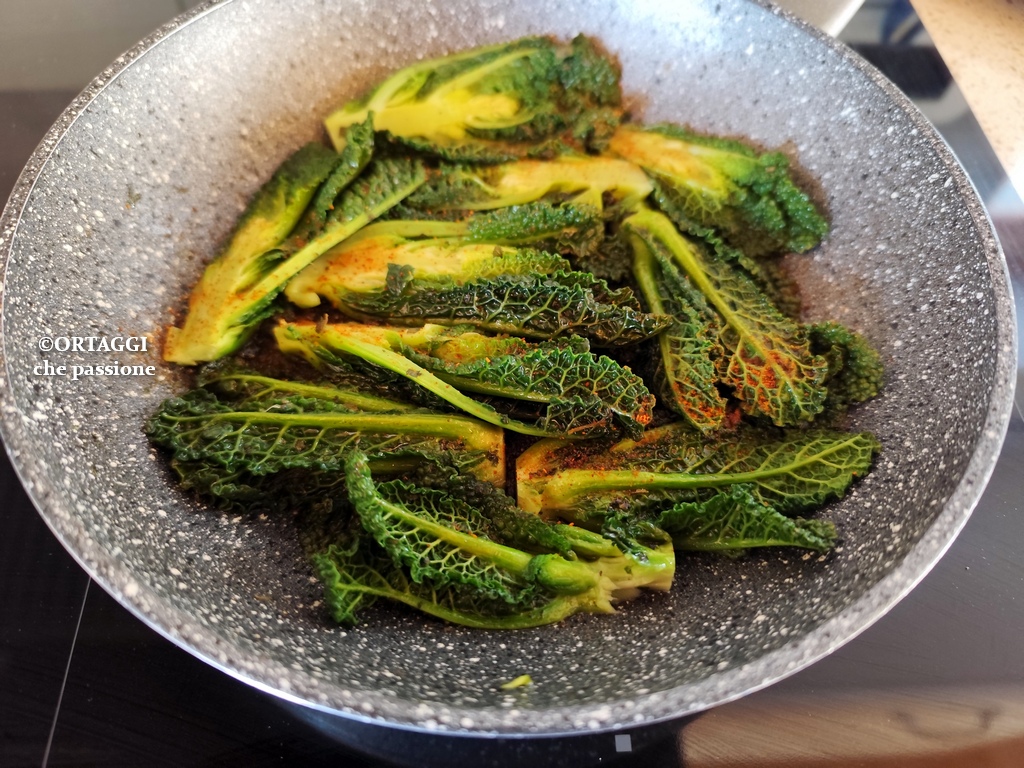 Black kale shoots in a skillet